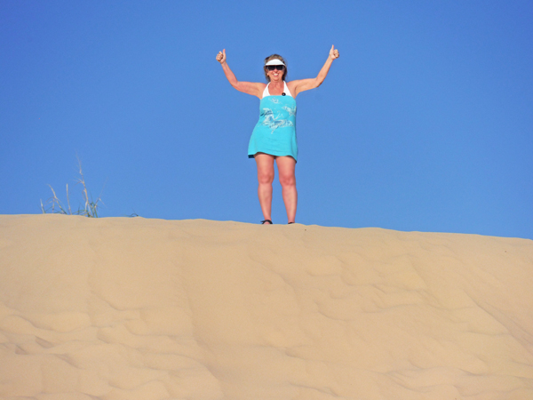 Karen at the top of a sand hill,